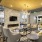 Resident lounge at our active adult community in New Braunfels, featuring cushioned chairs and a fireplace.