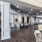 Resident lounge at our active adult community in New Braunfels, featuring cushioned chairs and wood grain floor paneling.