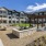 Courtyard at Larkspur at Creekside apartments in New Braunfels, TX, featuring landscaped gardens and apartment balconies.